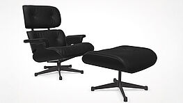 Der Vitra Lounge Chair mit Ottoman in Kastanie schwarz lackiert mit Premium Leder nero ist bei Grünbeck Einrichtungen zu einem Sonderpreis lagernd und sofort verfügbar