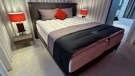 The Treca Paris Portofino bed, complete with the Imperial Corpus Prestige mattress and mattress topper, is available at a discounted sale price at Grünbeck Einrichtungen.