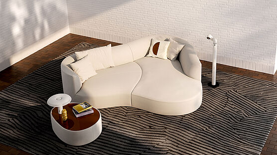 Siwa von COR: ein Sitzmöbel mit bogenförmiger Rückenlehne - erhältlich als Recamiere, kleines Sofa oder extragroßer Liegewiese bei Grünbeck Einrichtungen Wien