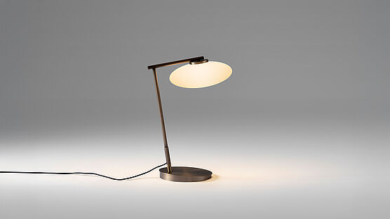 Mami  - the Penta table lamp with white oval glass bodies and bronze metal frame - a collection for pendant and table lamps - available from Grünbeck Vienna