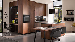 Wohnküchen und Raumgestaltung | Häcker Bali Nussbaum | Innenarchitektur und Kompletteinrichtungen bei Grünbeck in Wien