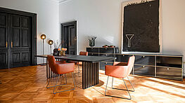 The Lamello dining table by ASCO has a solid wood top (available in various designs) on an airy steel frame—now available at Grünbeck Einrichtungen Vienna.