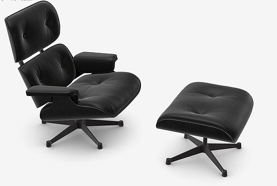 The Vitra Lounge Chair with Ottoman in black ash with black leather is in stock at Grünbeck Einrichtungen at a special price and available immediately