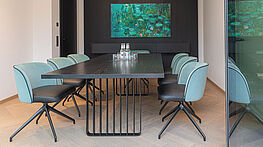 The Lamello table by ASCO has a solid wood top (available in various designs) on an airy steel frame—now available at Grünbeck Einrichtungen Vienna.