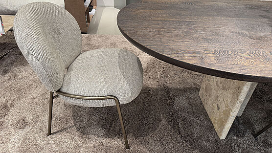 Three Freifrau Nana Low comfortable armchairs in the low dining version (seat height 43 cm) with an attractive look in Sahco Sahire fabric are now available at Grünbeck Einrichtungen in the design sale at a reduced price.