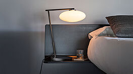 Mami  - the Penta table lamp with white oval glass bodies and bronze metal frame - a collection for pendant and table lamps - available from Grünbeck Vienna