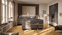 Wohnküche mit Insel grifflos | Häcker Smart GL steingrau | Innenarchitektur und Kompletteinrichtungen bei Grünbeck Wien