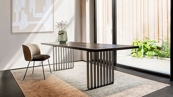The Lamello dining table by ASCO has a solid wood top (available in various designs) on an airy steel frame—now available at Grünbeck Einrichtungen Vienna.